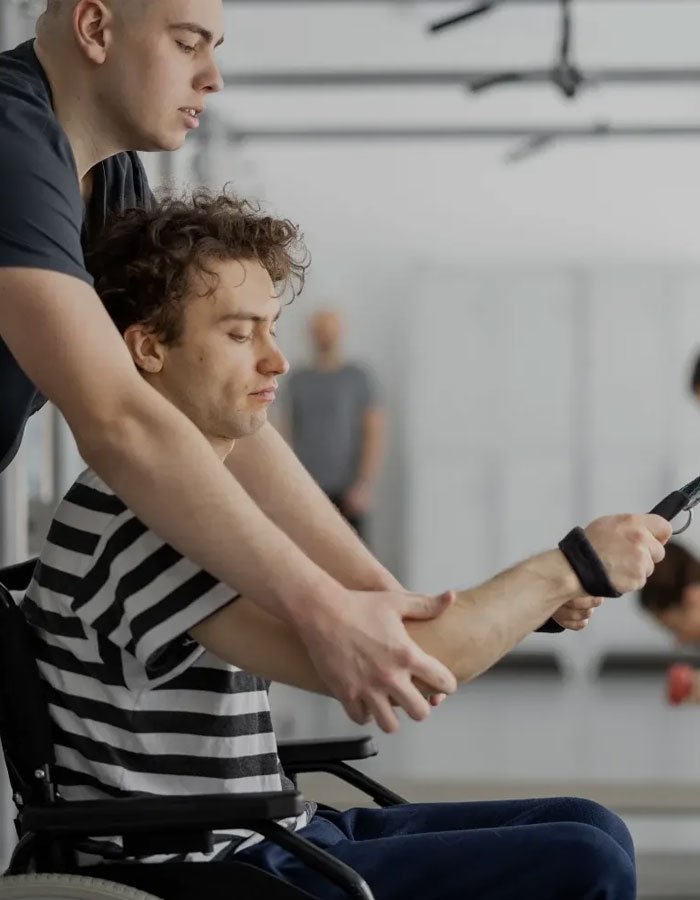 Personal trainer assisting client with weightlifting form